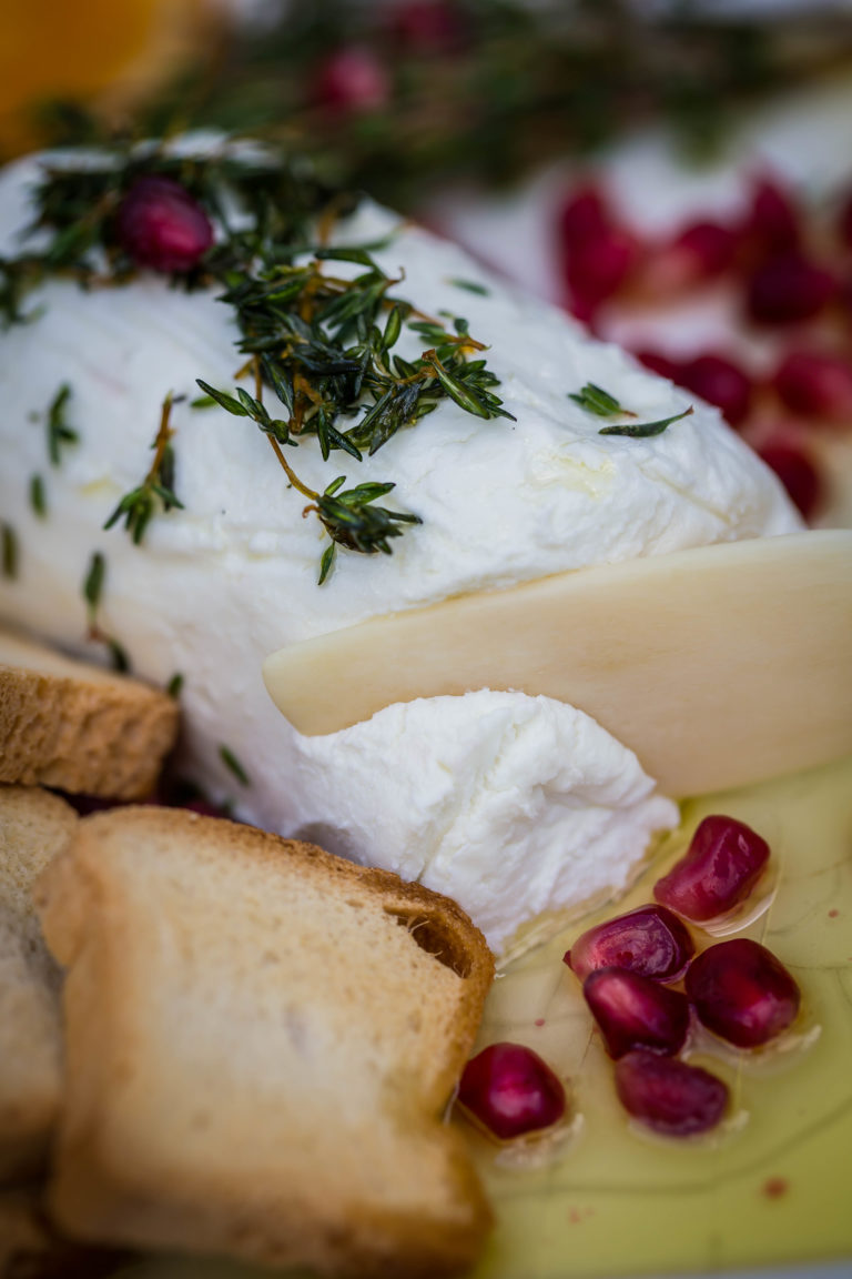 Chèvre goat cheese with fresh herbs and garlicinfused olive oil.