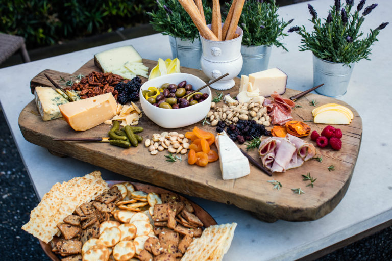 The ultimate cheese board with nuts, dried fruit, cheese and charcuterie.
