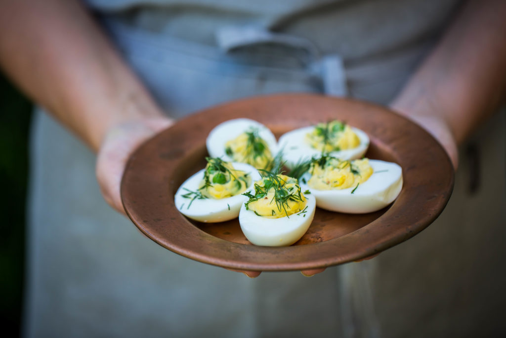 Deviled eggs with peas and dill